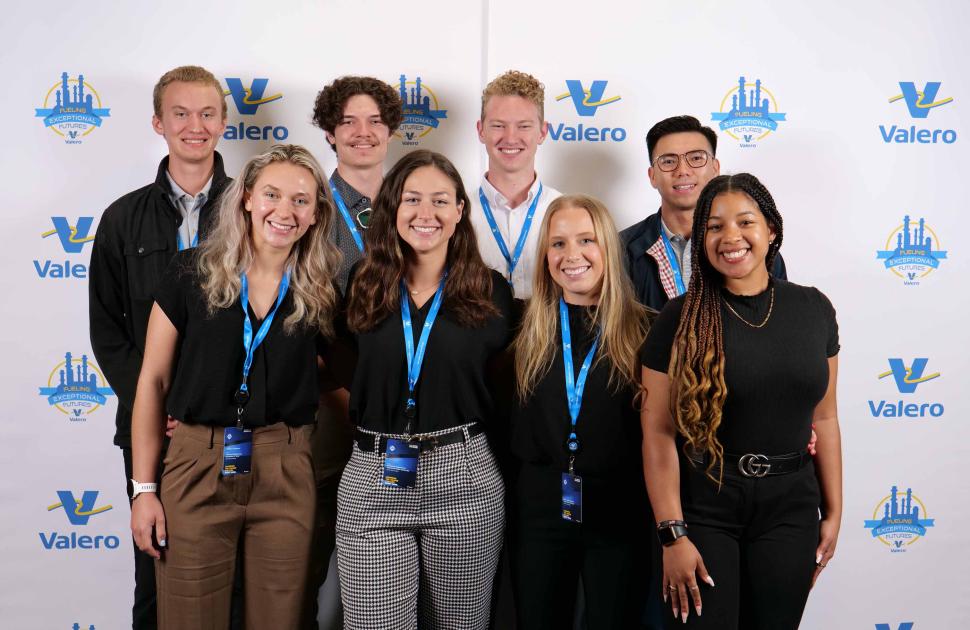 Intern group posed at a Kooilspetroleum branded photobooth.